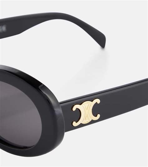 celine 01|Triomphe 01 oval sunglasses in black .